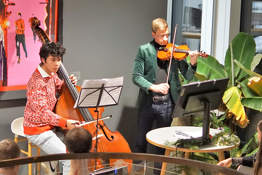 Jared and Juan Pineda (Allodi lab) perform at the 2022 department holiday party